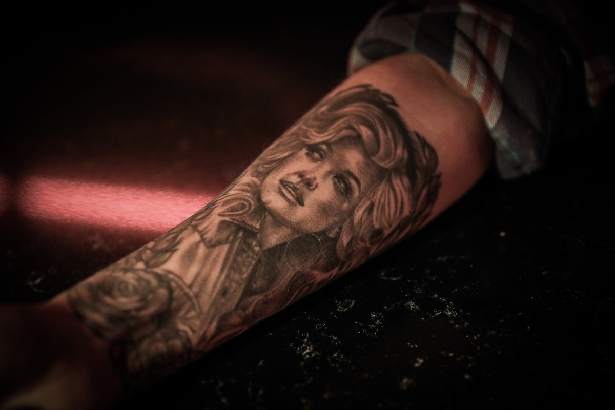 Inked Disciples: A Glimpse into the Ultimate Devotion, the Dolly Tattoo